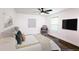 Modern bedroom featuring a ceiling fan, natural light, stylish furnishings, and contemporary décor at 1241 Bethsaida Rd, Riverdale, GA 30296