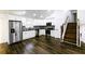 Bright, open kitchen with stainless steel appliances, white cabinets, and hardwood floors at 1241 Bethsaida Rd, Riverdale, GA 30296