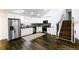 Bright, open kitchen with stainless steel appliances, white cabinets, and hardwood floors at 1241 Bethsaida Rd, Riverdale, GA 30296