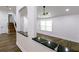Bright living room showing hardwood floors, easy access to the staircase and living area at 1241 Bethsaida Rd, Riverdale, GA 30296