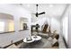 Inviting living room with neutral tones, modern furniture, ceiling fan, and views into the updated kitchen at 1241 Bethsaida Rd, Riverdale, GA 30296