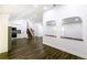 Bright and open floor plan with hardwood floors and kitchen leading to dining and living room at 1241 Bethsaida Rd, Riverdale, GA 30296