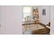 Bright office with a modern glass desk and built-in shelving at 1241 Bethsaida Rd, Riverdale, GA 30296