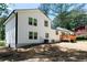 Charming two-story home featuring a newly built wooden deck and white siding at 1241 Bethsaida Rd, Riverdale, GA 30296