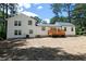 Charming two-story home featuring a newly built wooden deck and white siding at 1241 Bethsaida Rd, Riverdale, GA 30296