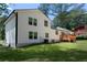 Charming two-story home featuring a newly built wooden deck and white siding at 1241 Bethsaida Rd, Riverdale, GA 30296