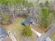 An aerial view shows the home nestled among trees on a spacious lot with a long driveway at 26 Alisha Nw Cir, Cartersville, GA 30121