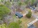 A high angle shot of the home's location on a street surrounded by mature trees and other homes at 26 Alisha Nw Cir, Cartersville, GA 30121