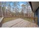 A wooden back deck overlooks the wooded backyard and offers space for outdoor living at 26 Alisha Nw Cir, Cartersville, GA 30121
