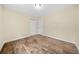 This bedroom offers wood-look floors, neutral walls, and ample closet space for storage at 26 Alisha Nw Cir, Cartersville, GA 30121