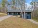 Charming blue home with a well-maintained front yard and inviting entryway, surrounded by mature trees at 26 Alisha Nw Cir, Cartersville, GA 30121