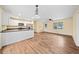 Open kitchen with white cabinetry, modern appliances, and breakfast bar seating overlooking the living area at 26 Alisha Nw Cir, Cartersville, GA 30121