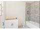 Bathroom featuring a tub, tile surround, open vanity and a window at 4222 Matisse Ln, Fairburn, GA 30213
