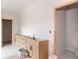 Bathroom vanity cabinets with black handles and light counter tops still needs to be installed at 4222 Matisse Ln, Fairburn, GA 30213