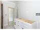 A view of bathroom with an unfinished vanity and doorway leading into another room at 4222 Matisse Ln, Fairburn, GA 30213