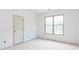 A new bedroom in a home under construction with a window overlooking another home at 4222 Matisse Ln, Fairburn, GA 30213