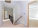 Hallway leading to bedrooms with stairs with wooden railing at 4222 Matisse Ln, Fairburn, GA 30213
