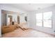 Open-concept living room with hardwood floors and an abundance of natural light at 4222 Matisse Ln, Fairburn, GA 30213