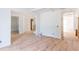 Spacious living room featuring hardwood floors, a staircase, and coffered ceilings ready for finishing touches at 4222 Matisse Ln, Fairburn, GA 30213