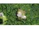 Aerial view of the home and the surrounding lush greenery at 116 Woolsey Creek Trl, Fayetteville, GA 30215