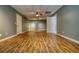 Finished basement with wood-look flooring, neutral walls, and ample space for recreation or storage at 116 Woolsey Creek Trl, Fayetteville, GA 30215