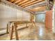 Expansive unfinished basement with exposed ductwork, presenting an opportunity for personalized renovation and design at 116 Woolsey Creek Trl, Fayetteville, GA 30215