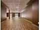 Spacious finished basement featuring plank floors and sliding glass door at 116 Woolsey Creek Trl, Fayetteville, GA 30215
