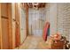 Unfinished basement space featuring a brick wall, door, and exposed utilities, ready for customization at 116 Woolsey Creek Trl, Fayetteville, GA 30215