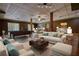 Spacious basement features a pool table, living spaces, and ample room for entertaining at 116 Woolsey Creek Trl, Fayetteville, GA 30215