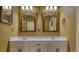 Elegant bathroom with double vanity, custom mirrors, and ample storage at 116 Woolsey Creek Trl, Fayetteville, GA 30215