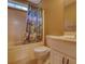 Bright bathroom with tub/shower combination with fish curtain and white vanity at 116 Woolsey Creek Trl, Fayetteville, GA 30215