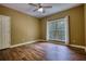 Bedroom featuring hardwood flooring, natural light, and great closet space at 116 Woolsey Creek Trl, Fayetteville, GA 30215