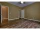 Bedroom featuring hardwood flooring, neutral color palette, and ample space at 116 Woolsey Creek Trl, Fayetteville, GA 30215