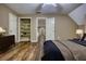 Comfortable bedroom features hardwood floors, a closet, and neutral paint colors at 116 Woolsey Creek Trl, Fayetteville, GA 30215