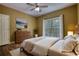 Cozy bedroom with hardwood floors, dresser, large window, and great natural light at 116 Woolsey Creek Trl, Fayetteville, GA 30215