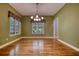 Elegant dining room with large windows, showcasing natural light and enhancing the dining experience at 116 Woolsey Creek Trl, Fayetteville, GA 30215