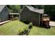 Beautiful home with an expansive deck and a well-maintained, sloping lawn with a fence at 116 Woolsey Creek Trl, Fayetteville, GA 30215