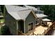 Charming home with a large wooden deck, perfect for outdoor entertaining with a table and umbrella at 116 Woolsey Creek Trl, Fayetteville, GA 30215