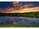 Picturesque sunset view reflected in a calm lake, showcasing a serene and beautiful landscape at 116 Woolsey Creek Trl, Fayetteville, GA 30215