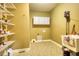 Functional laundry room with shelving, sink, and carpet, creating a dedicated and convenient space at 116 Woolsey Creek Trl, Fayetteville, GA 30215