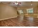 Spacious living area with hardwood floors and a ceiling fan for added comfort at 116 Woolsey Creek Trl, Fayetteville, GA 30215