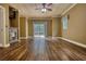 Living room with wood floors, fireplace, and view of backyard through sliding door at 116 Woolsey Creek Trl, Fayetteville, GA 30215