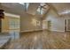 Bright living room showcasing hardwood floors, an open layout, and a glimpse into adjacent spaces at 116 Woolsey Creek Trl, Fayetteville, GA 30215