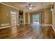 Cozy living room with plank floors, fireplace, and sliding glass door to backyard at 116 Woolsey Creek Trl, Fayetteville, GA 30215