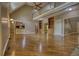 Expansive living room with hardwood floors, high ceilings, and access to the kitchen area at 116 Woolsey Creek Trl, Fayetteville, GA 30215