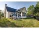 An inviting backyard with a sunroom extension and ample space for outdoor activities and leisure at 121 St Albans Way, Peachtree City, GA 30269