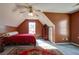 Cozy bedroom features angled ceilings, ceiling fan, and natural light at 121 St Albans Way, Peachtree City, GA 30269