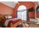 Comfortable bedroom featuring a large window and mounted TV at 121 St Albans Way, Peachtree City, GA 30269