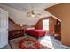 Bright bedroom features a ceiling fan, ample natural light, and a cozy rug at 121 St Albans Way, Peachtree City, GA 30269
