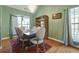 Charming dining room features a decorative chandelier, hardwood floors, and window at 121 St Albans Way, Peachtree City, GA 30269